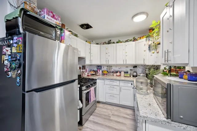 a bedroom with furniture and a wooden floor
