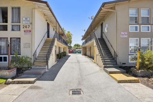 a kitchen with a sink stove and refrigerator