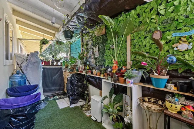 a kitchen with stainless steel appliances a refrigerator and a stove top oven