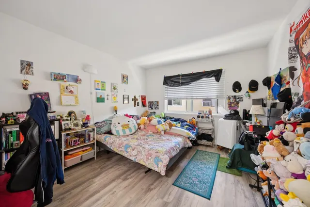 a room with furniture and musical instruments