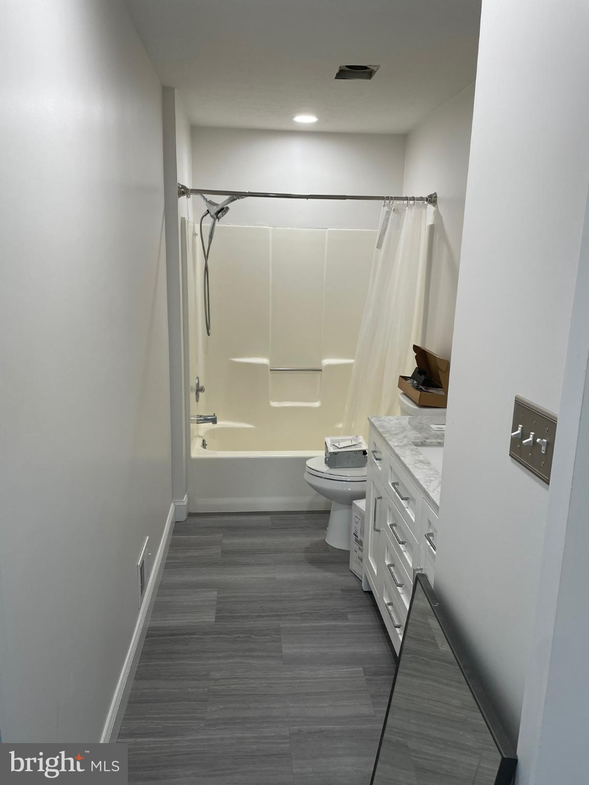 7105 Split Rail Lane Laurel, MD 20707 - Photo 12 of 12 a bathroom with a toilet and a shower