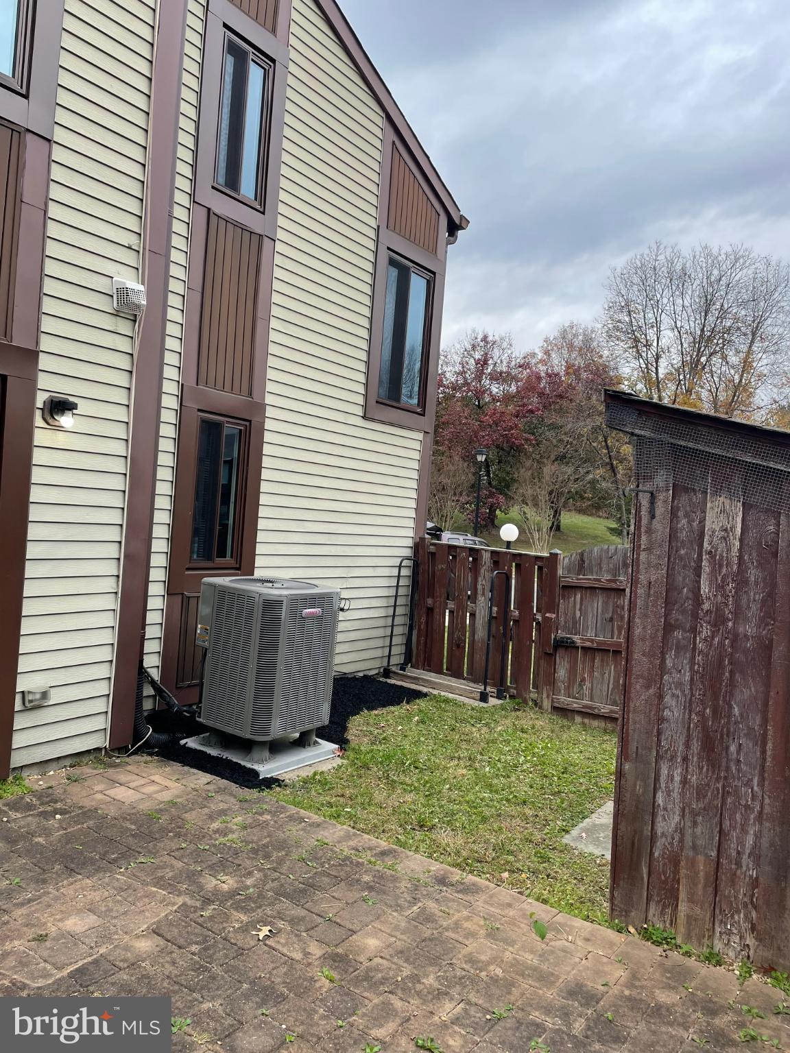 7105 Split Rail Lane Laurel, MD 20707 - Photo 5 of 12 a view of a backyard with pathway and a barn