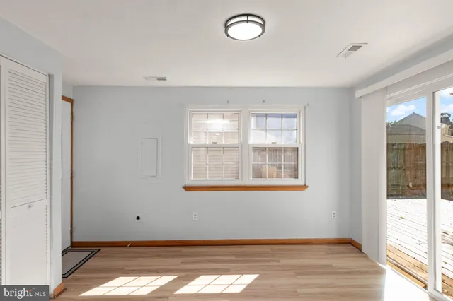 a kitchen with granite countertop a stove and cabinets