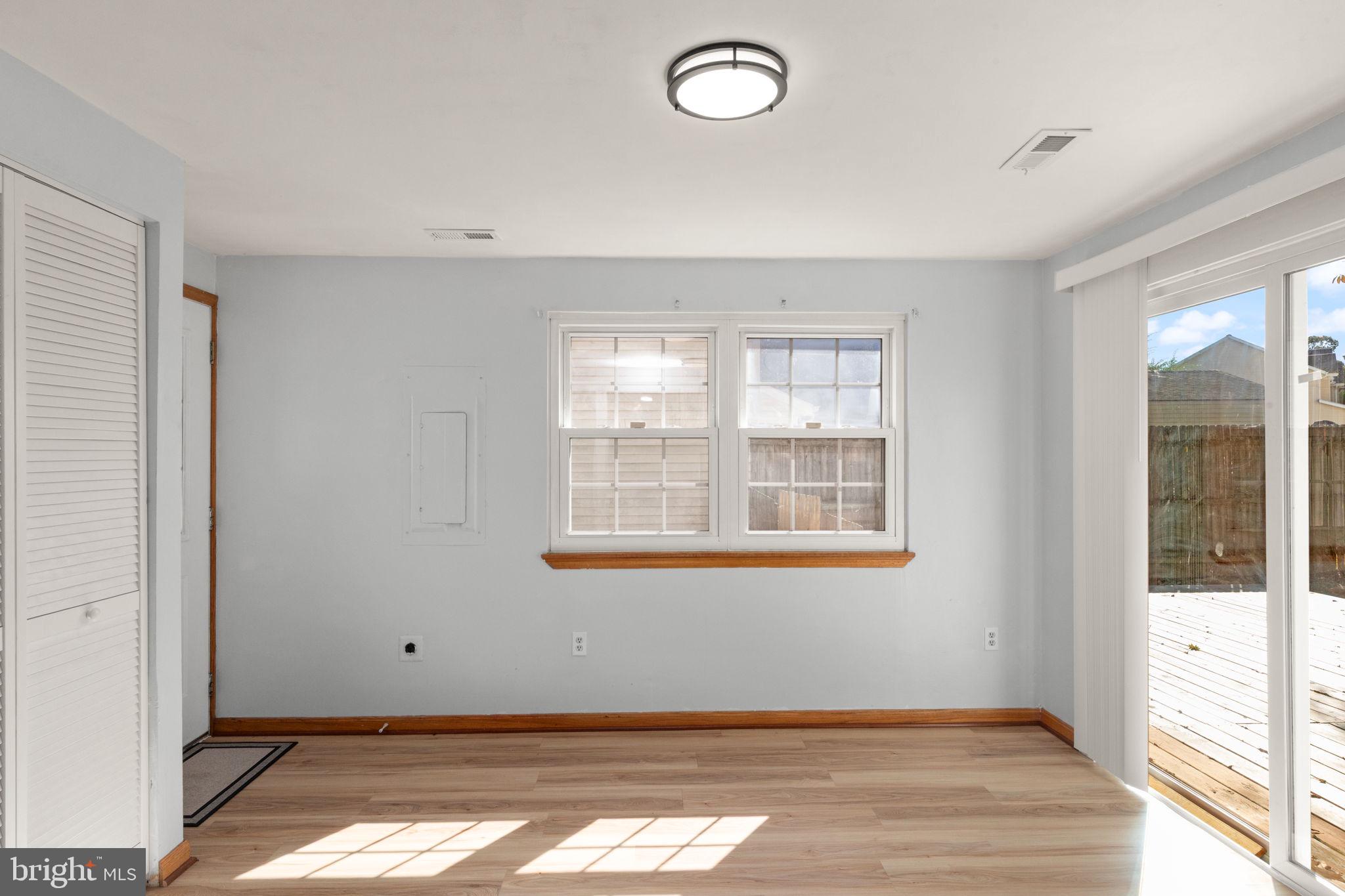126 Laburnum Road Edgewood, MD 21040 - Photo 10 of 30 a view of an empty room with wooden floor and a window