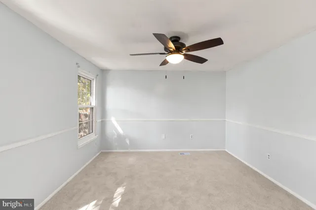 a kitchen with granite countertop a stove a sink and a cabinets