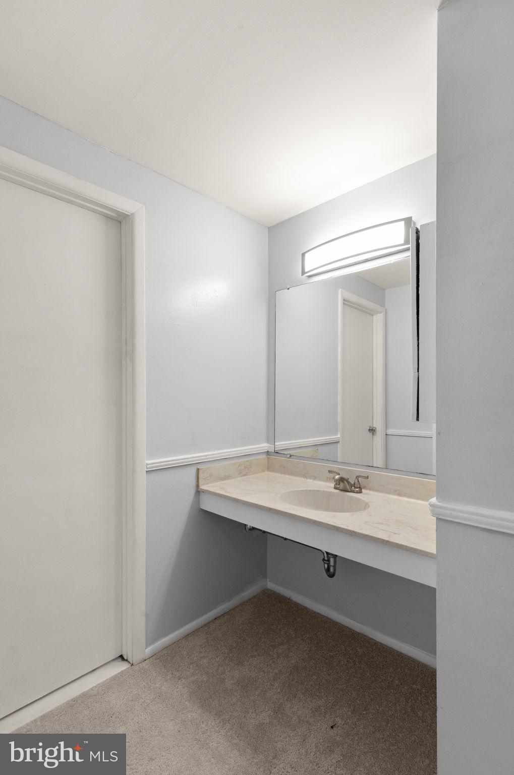 126 Laburnum Road Edgewood, MD 21040 - Photo 15 of 30 a bathroom with a sink and a mirror