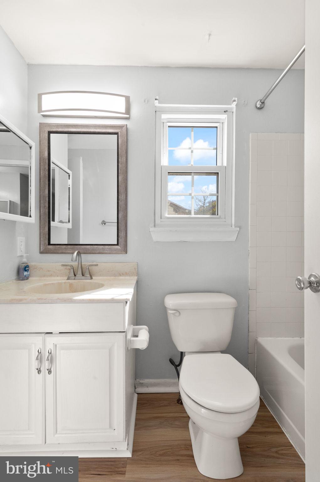 126 Laburnum Road Edgewood, MD 21040 - Photo 16 of 30 a bathroom with a granite countertop toilet a sink and mirror