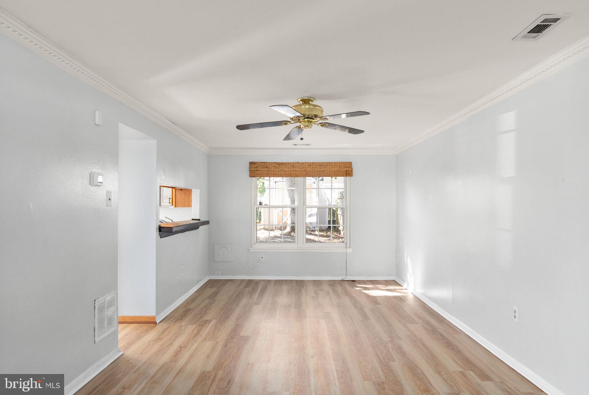 126 Laburnum Road Edgewood, MD 21040 - Photo 29 of 30 wooden floor in an empty room with a window