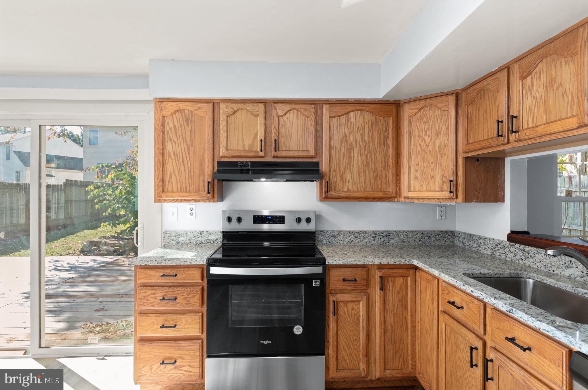 126 Laburnum Road Edgewood, MD 21040 - Photo 7 of 30 a kitchen with granite countertop a sink and a stove