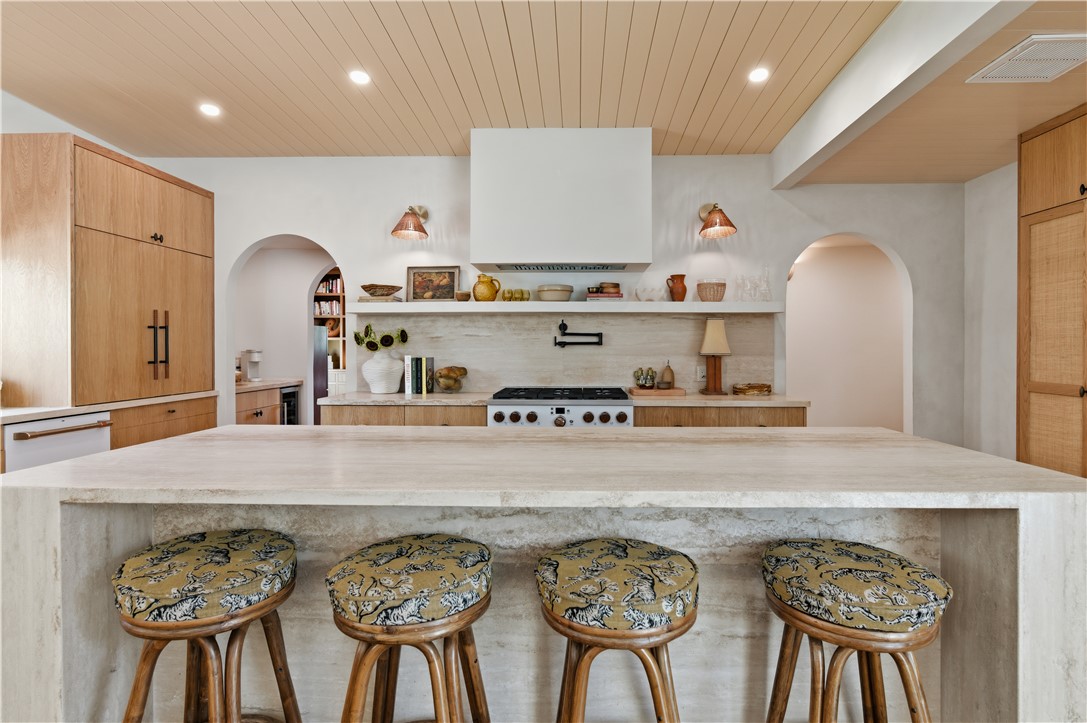 805 Vine Street Bryan, TX 77802 - Photo 14 of 45 9-foot travertine island with a waterfall edge. Eat up bar for 4