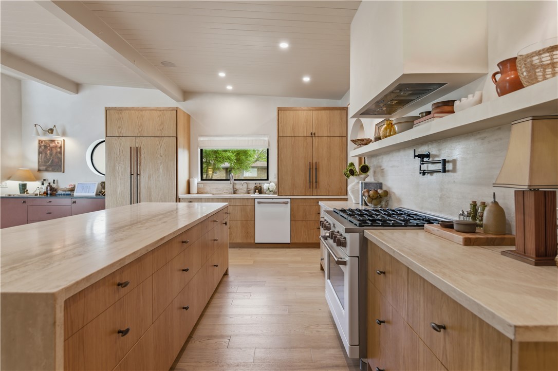 805 Vine Street Bryan, TX 77802 - Photo 15 of 45 Expansive kitchen with gas range, plastered hood vent, pot filler and panel ready kitchen aid refrigerator and freezer