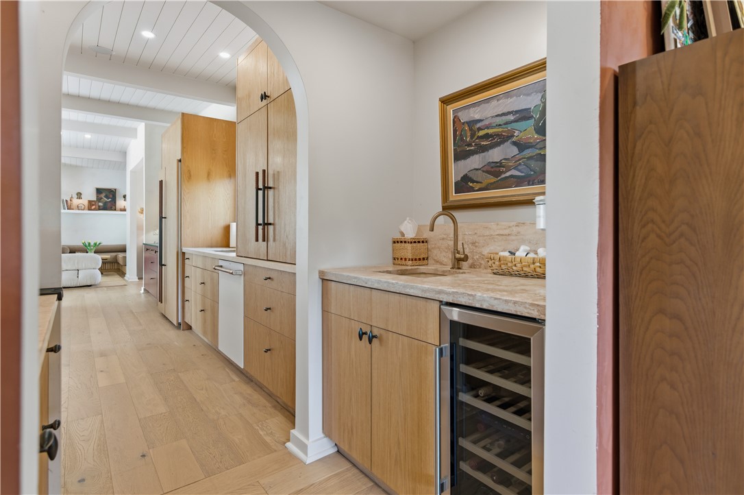 805 Vine Street Bryan, TX 77802 - Photo 18 of 45 Butler's pantry with wine fridge, sink and custom cabinetry