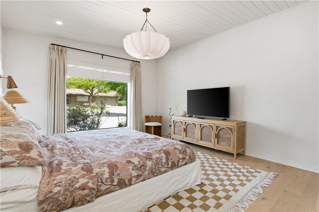 805 Vine Street Bryan, TX 77802 - Photo 22 of 45 Primary suite with ample natural light and custom draperies