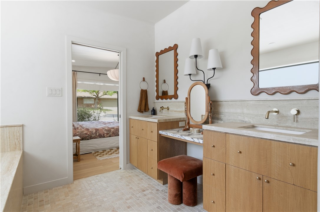 805 Vine Street Bryan, TX 77802 - Photo 23 of 45 Primary suite bathroom with double vanities and dedicated makeup counter with seating