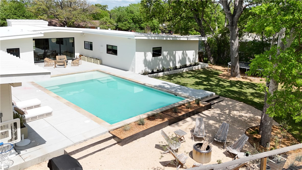 805 Vine Street Bryan, TX 77802 - Photo 5 of 45 Entertainers dream of a backyard - pool, firepit area, side yard with play area and patio