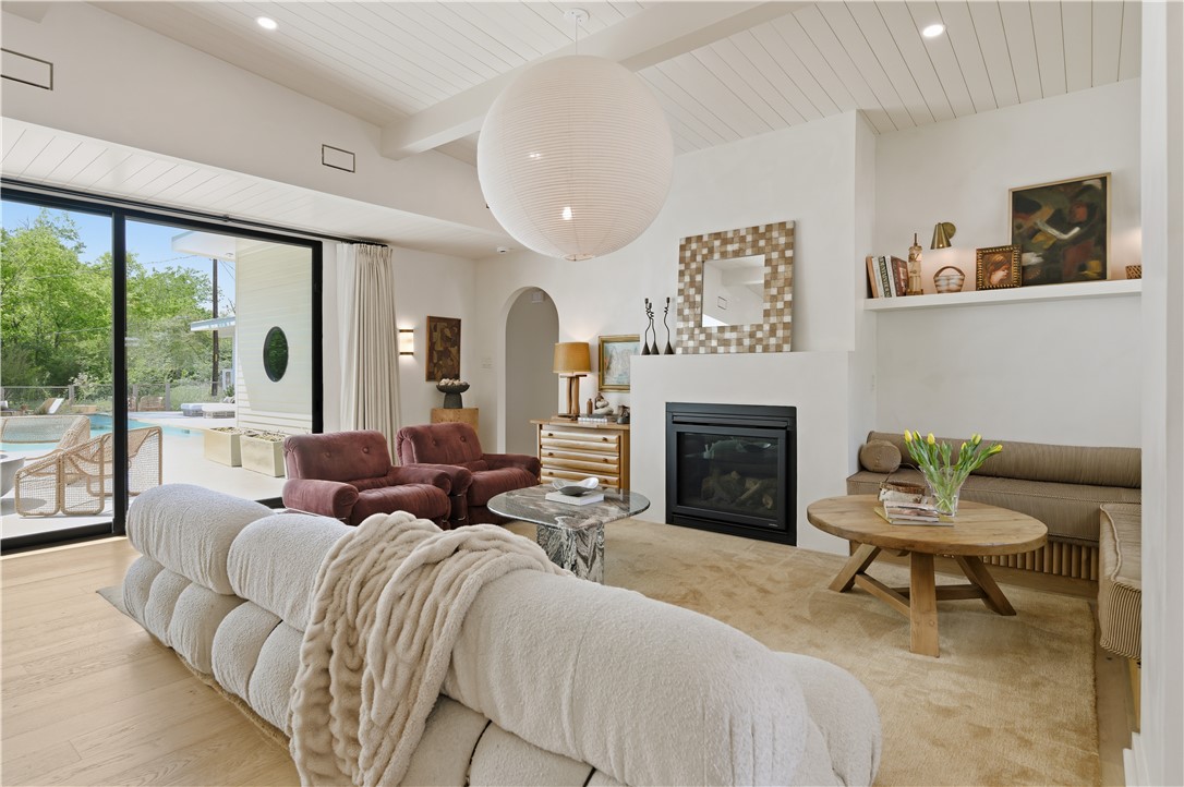 805 Vine Street Bryan, TX 77802 - Photo 7 of 45 Luxurious living room with limewashed walls throughout the home. Gas fireplace