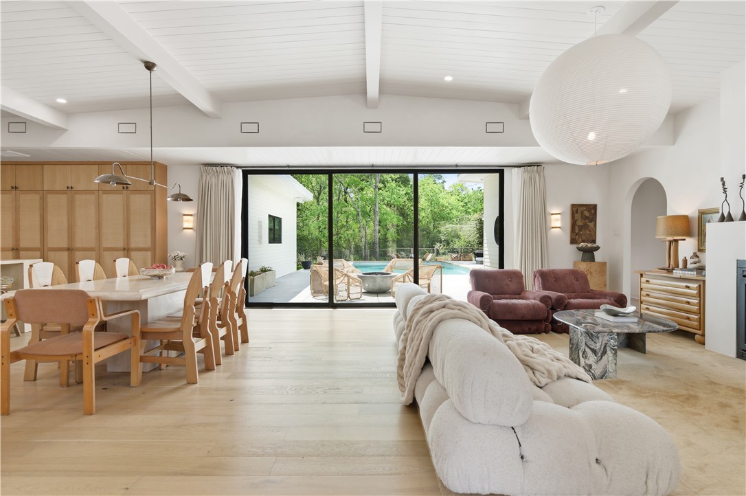 805 Vine Street Bryan, TX 77802 - Photo 8 of 45 Floor to ceiling sliding doors provide ample light and a picturesque view. Custom draperies for light filtering and privacy.