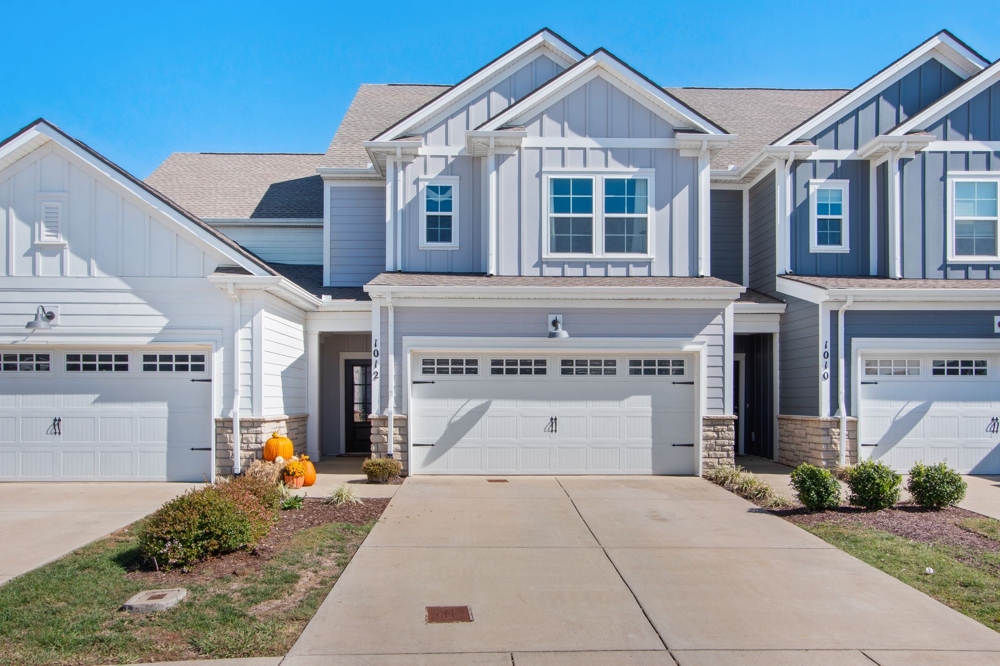 a front view of a house with garage