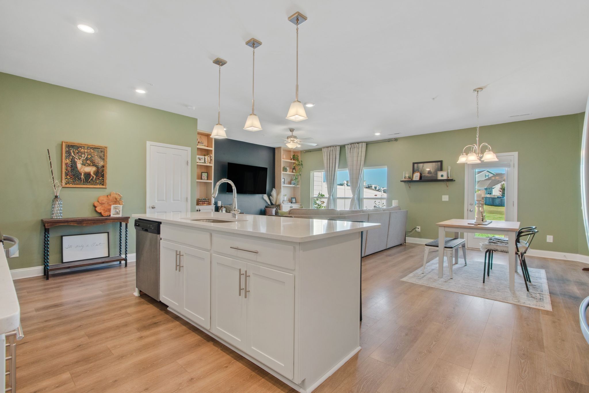 1012 June Wilde Ridge Spring Hill, TN 37174 - Photo 13 of 49 a kitchen with stainless steel appliances granite countertop stove top oven and cabinets