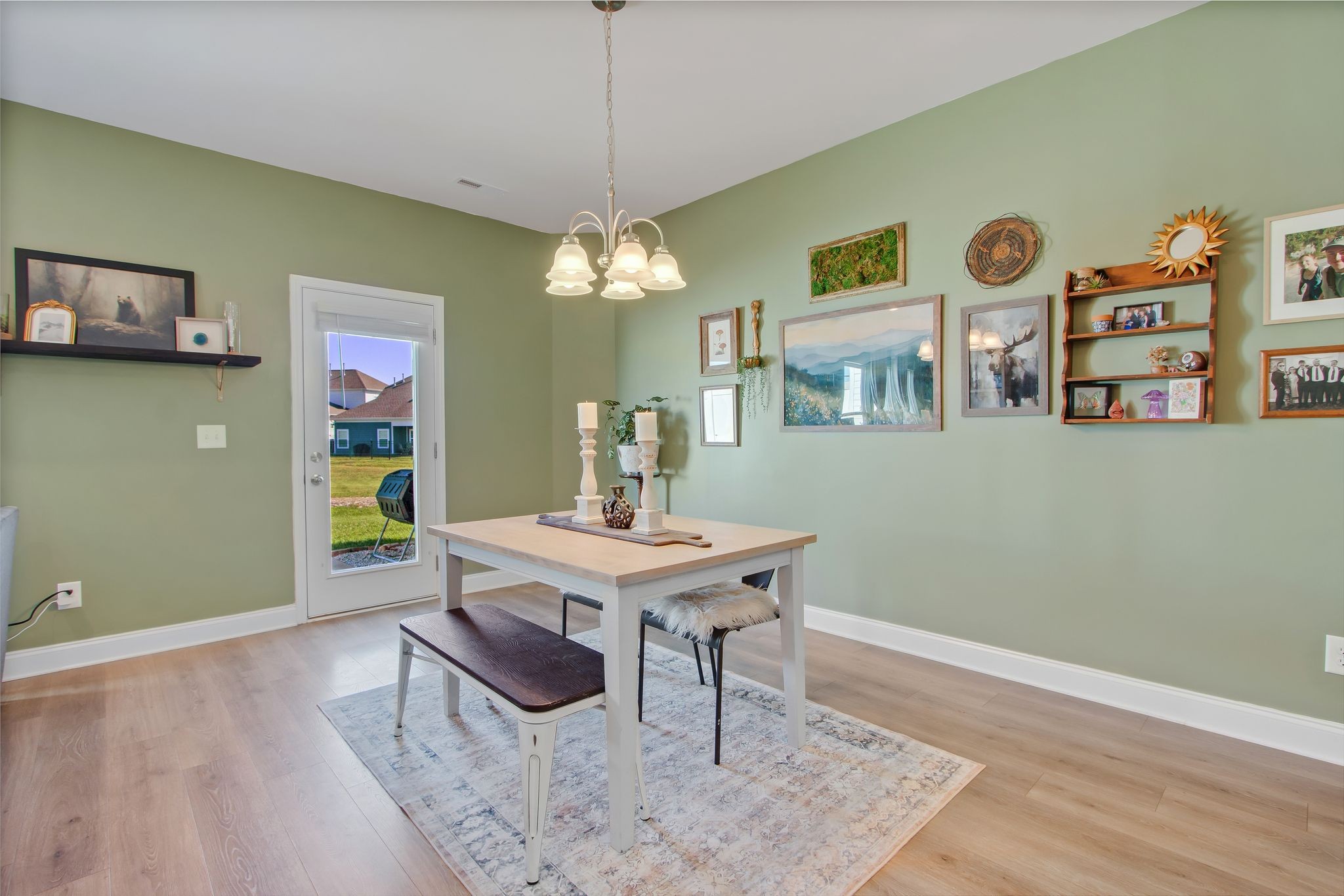 1012 June Wilde Ridge Spring Hill, TN 37174 - Photo 15 of 49 a view of a dining room with furniture and chandelier