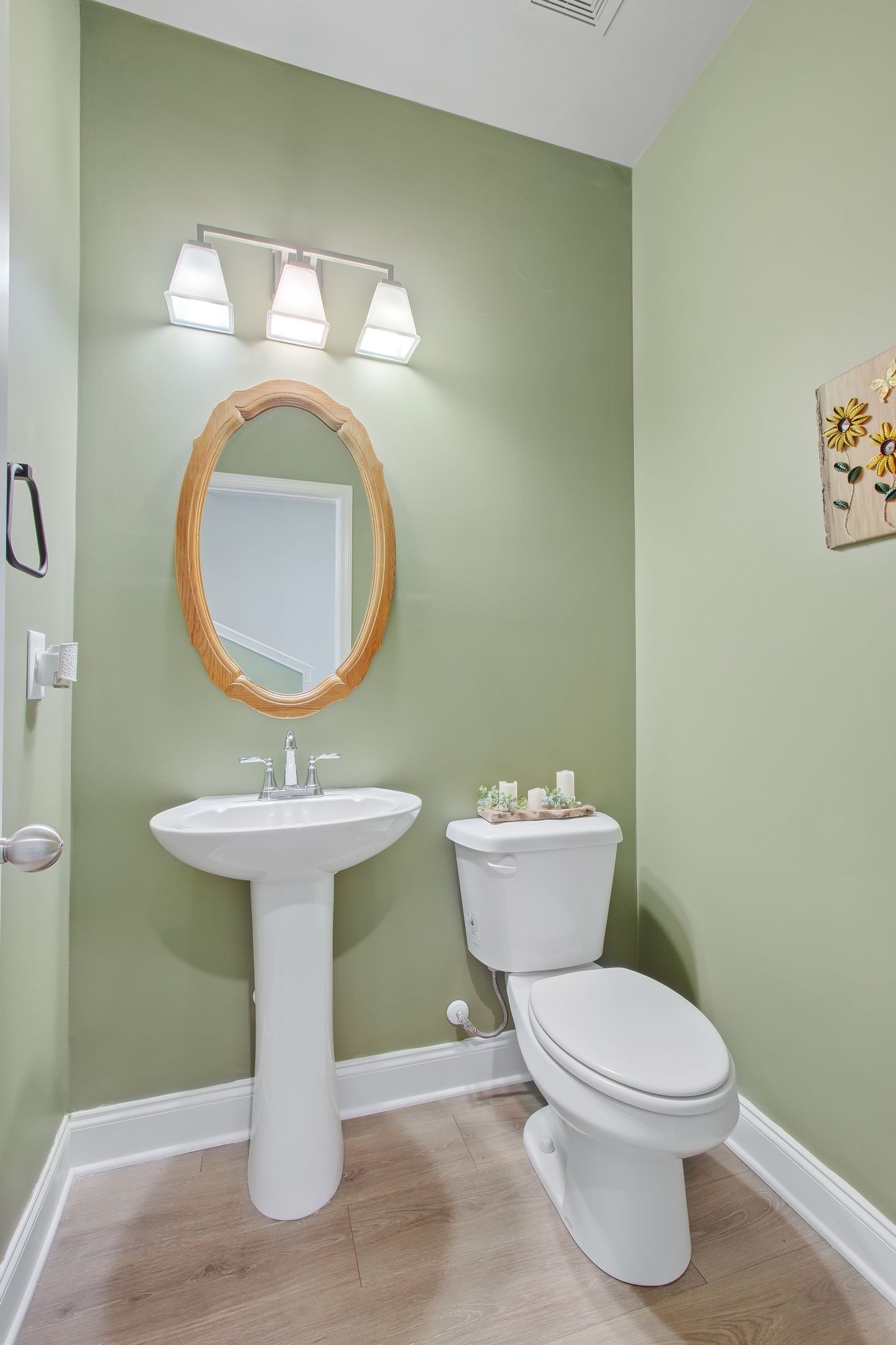 1012 June Wilde Ridge Spring Hill, TN 37174 - Photo 17 of 49 a bathroom with a toilet sink and mirror