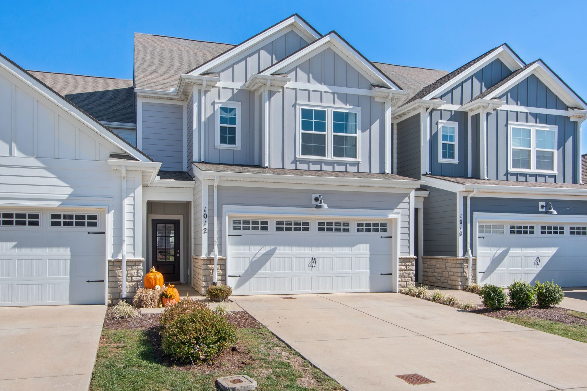 1012 June Wilde Ridge Spring Hill, TN 37174 - Photo 2 of 49 a front view of a house with a yard and garage