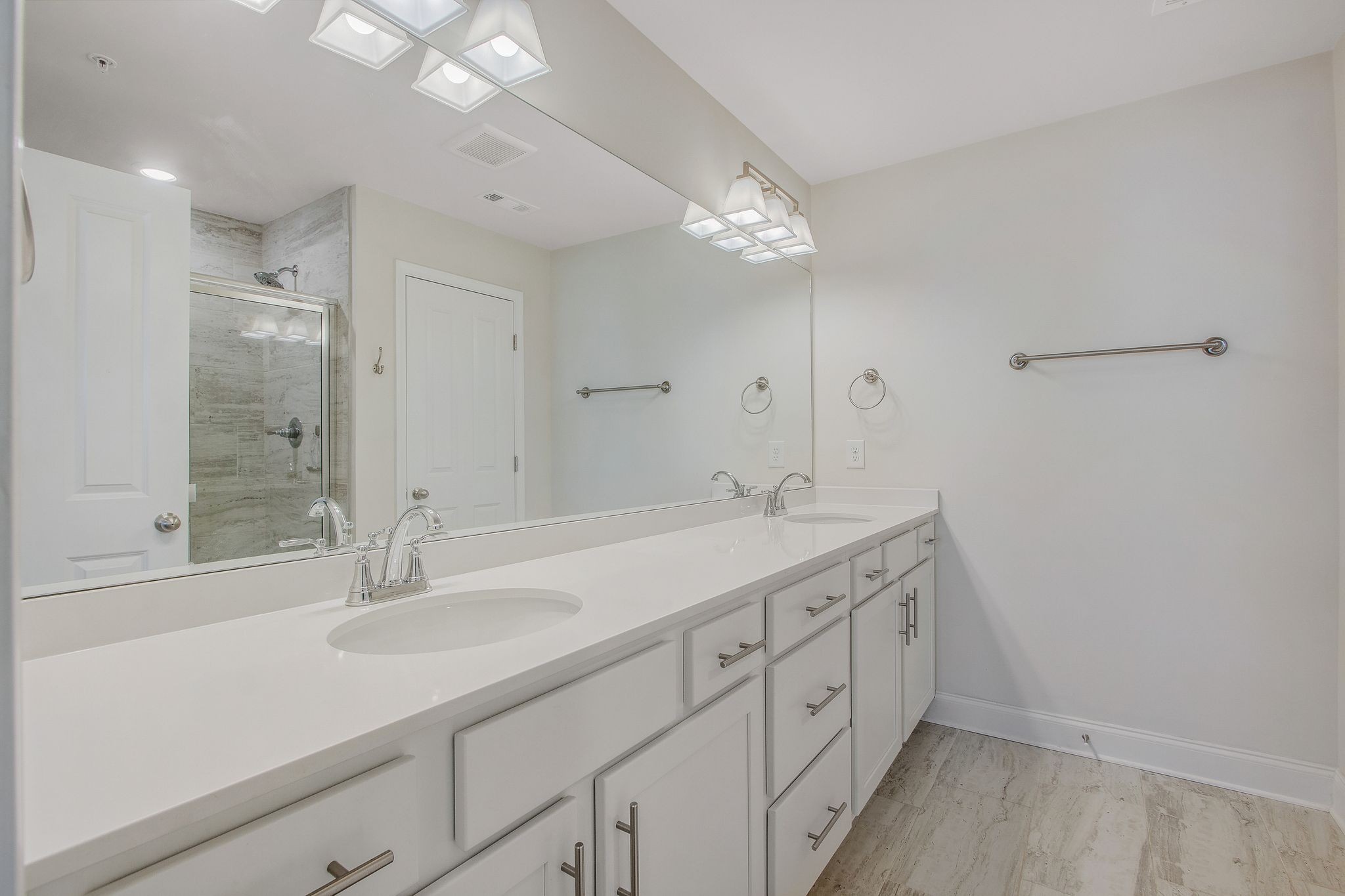 1012 June Wilde Ridge Spring Hill, TN 37174 - Photo 22 of 49 a bathroom with a double vanity sink and a mirror