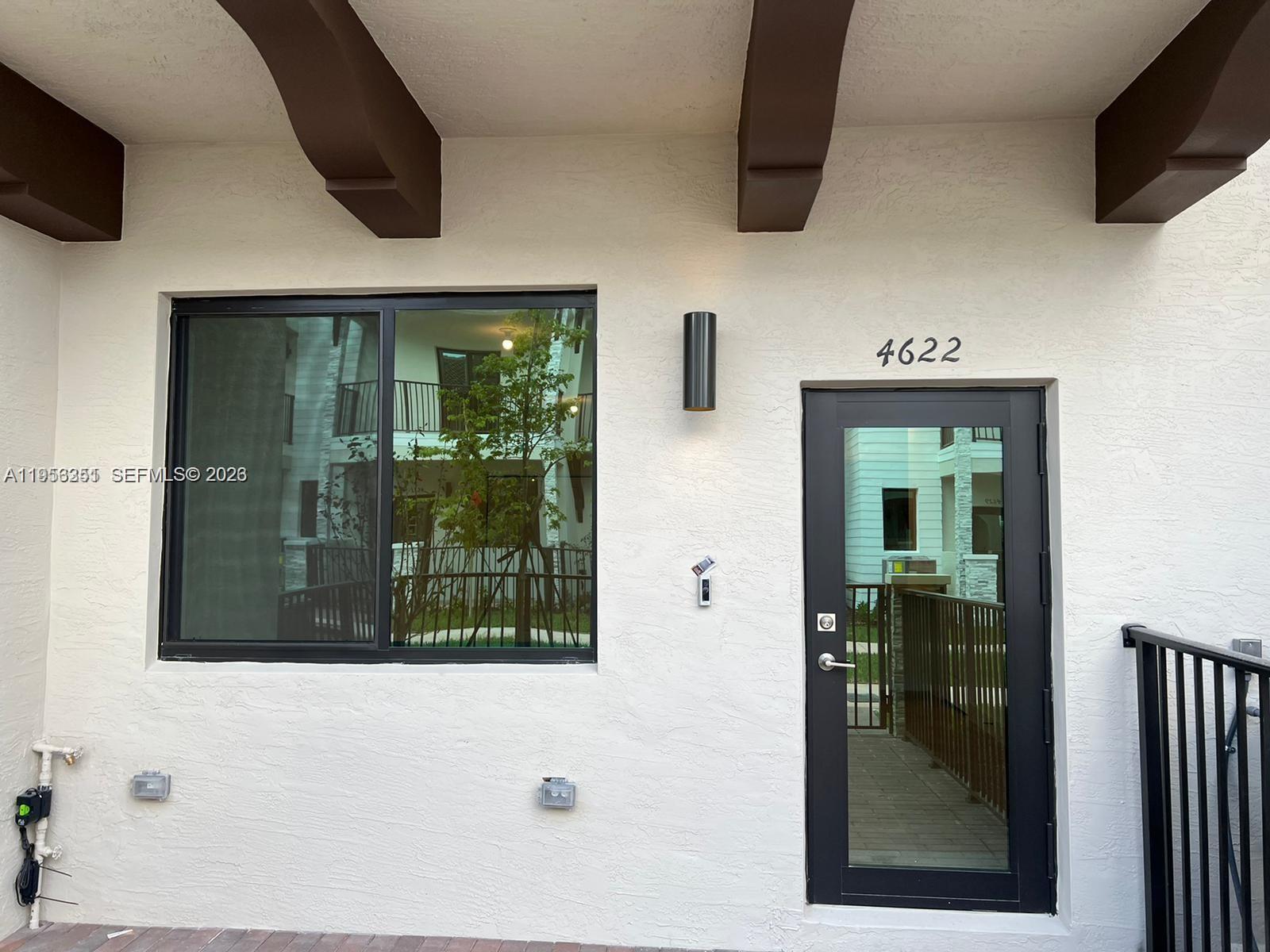 4622 Northwest 83rd Path Doral, FL 33166 - Photo 2 of 13 a view of a entryway door of the house