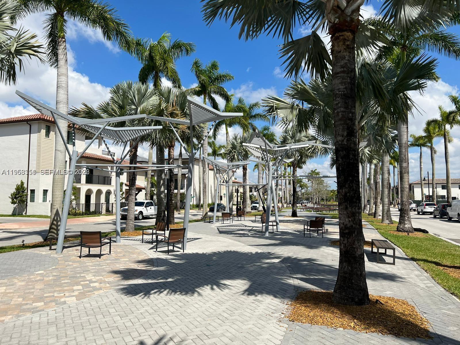 4622 Northwest 83rd Path Doral, FL 33166 - Photo 3 of 13 a view of a street with palm trees