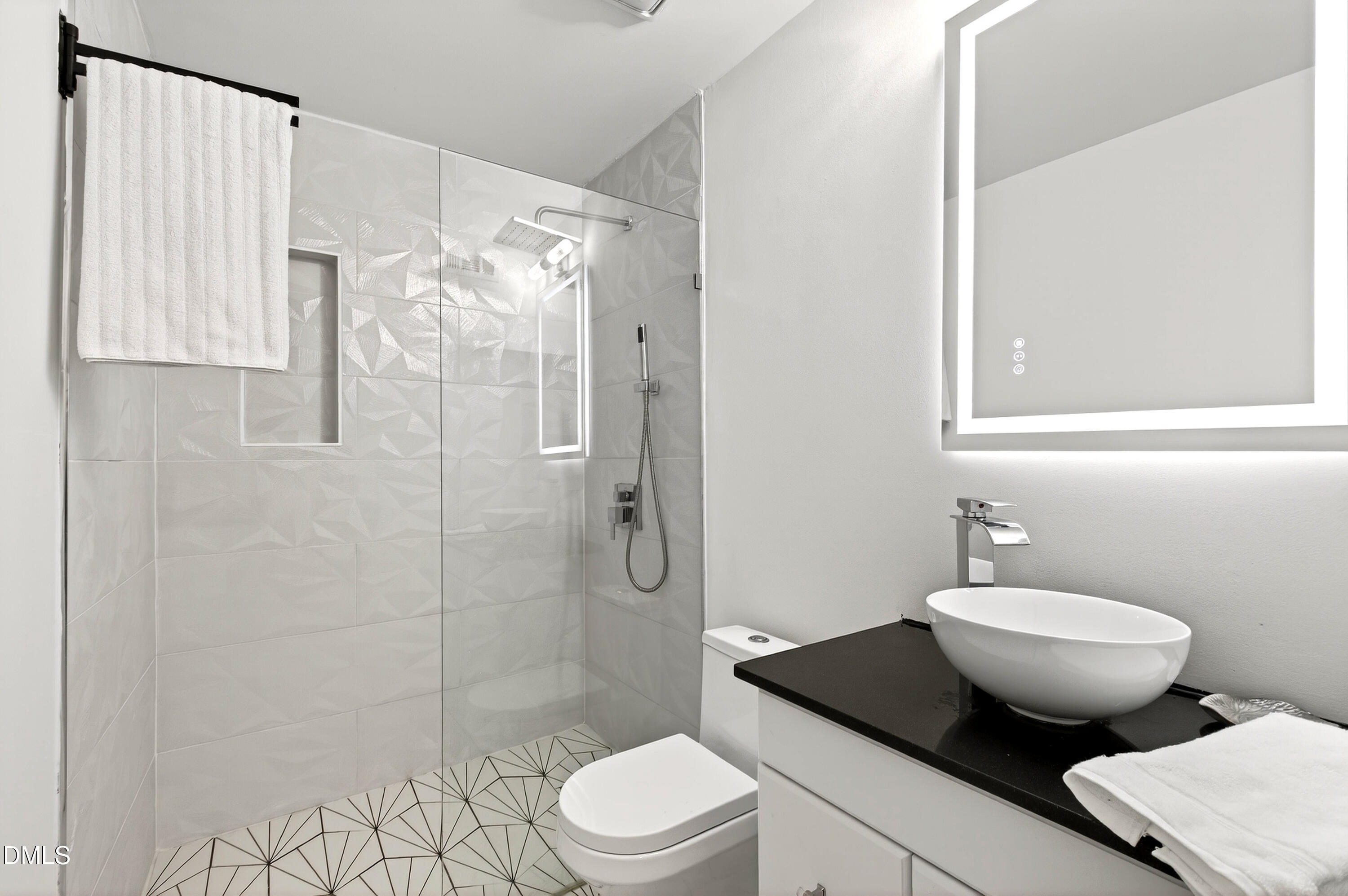 4507 Edwards Mill Road, Unit G Raleigh, NC 27612 - Photo 2 of 19 a bathroom with a sink toilet a mirror and shower
