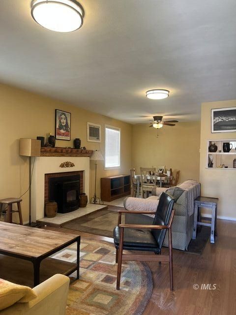 103 North Clay Street Independence, CA 93526 - Photo 12 of 25 a living room with furniture and a fireplace
