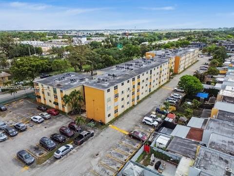 606 West 81st Street, Unit 120 Hialeah, FL 33014 - Photo 10 of 14 an aerial view of a house with a garden