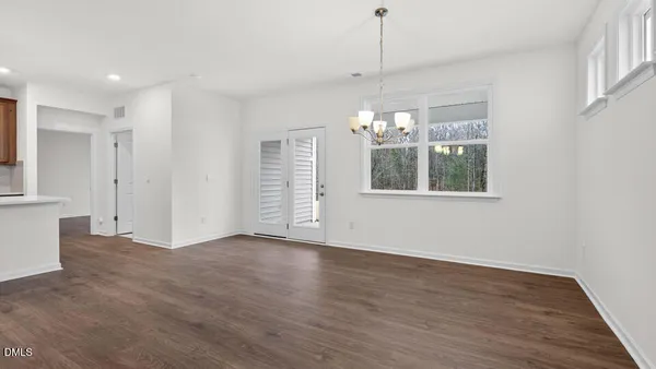 a bathroom with a granite countertop sink toilet a mirror and shower