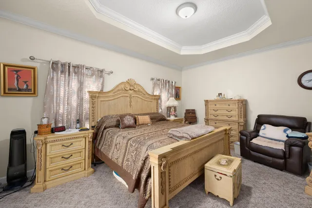 a bedroom with a bed and a couch