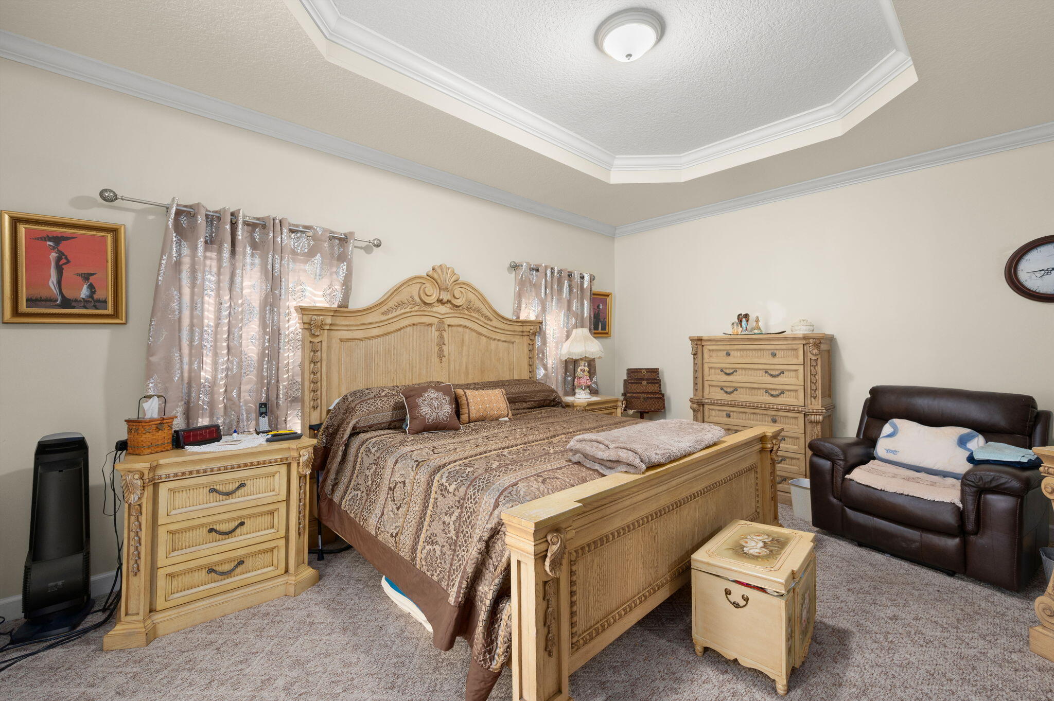 1545 Southwest Mockingbird Circle Port St. Lucie, FL 34986 - Photo 18 of 24 a bedroom with a bed and a couch