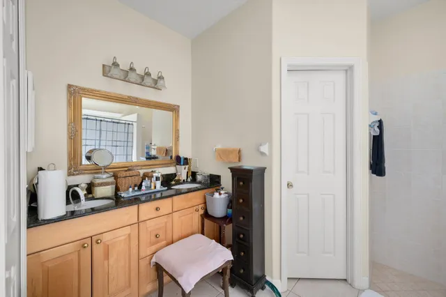 a kitchen with a refrigerator and a stove top oven