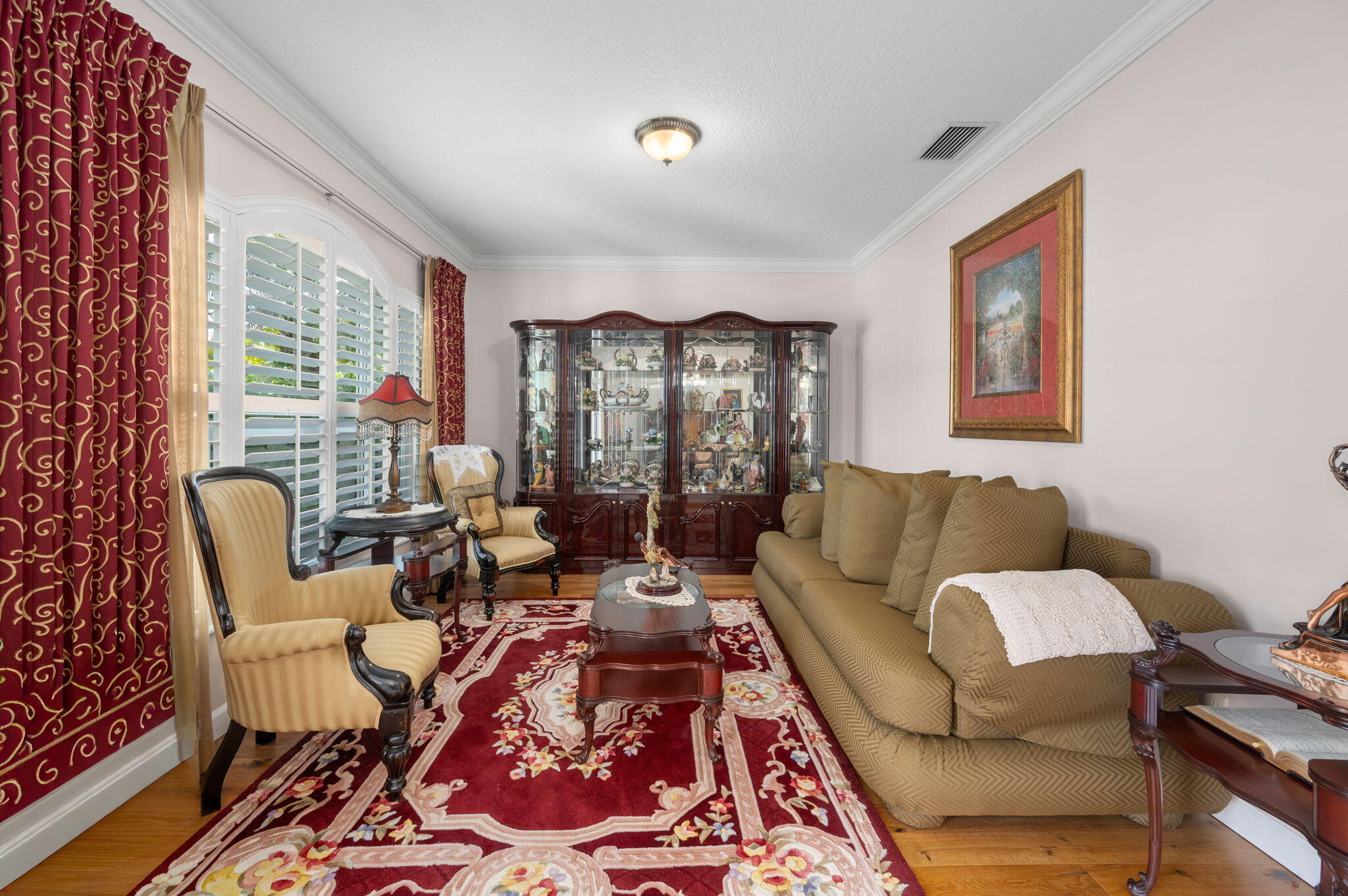 1545 Southwest Mockingbird Circle Port St. Lucie, FL 34986 - Photo 5 of 24 a living room with furniture and a large window
