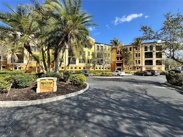 a car parked in front of a white building