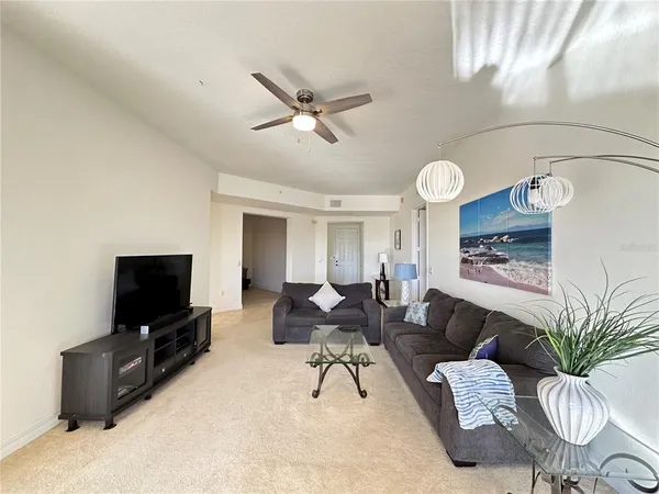a large kitchen with kitchen island a sink stainless steel appliances and cabinets