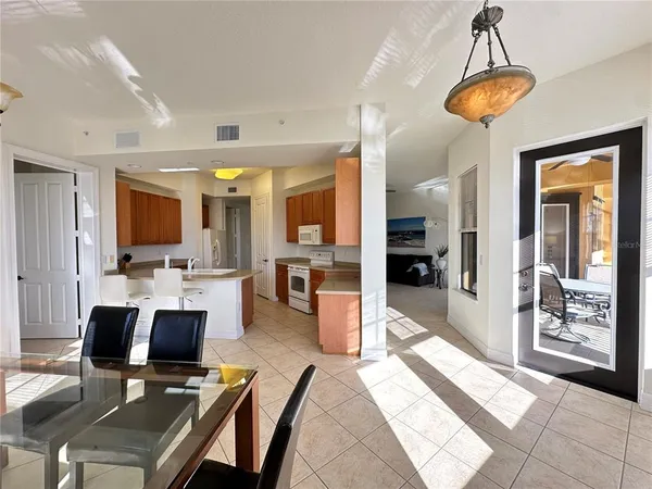 a kitchen with a sink stove top oven and refrigerator
