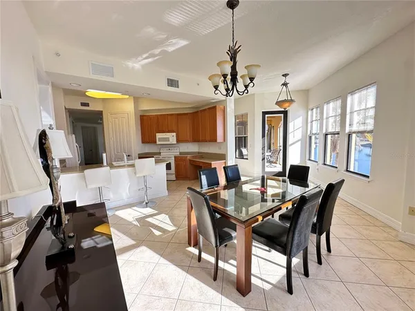 a spacious bathroom with a double vanity sink a mirror and a bathtub