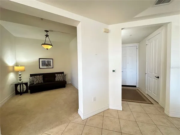a view of a livingroom with furniture and a potted plant
