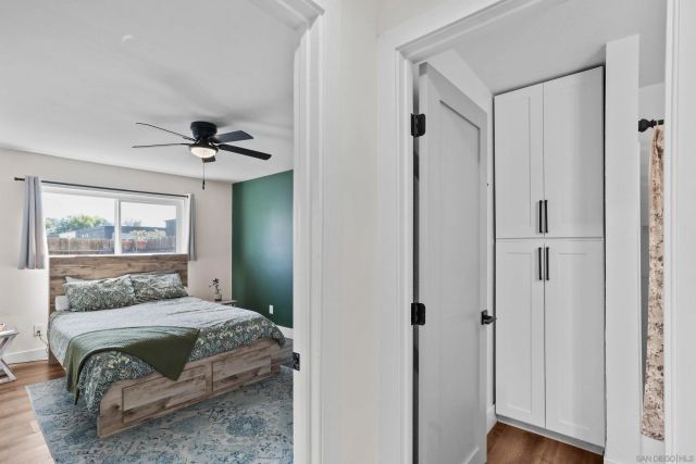 a bedroom with a bed and a dresser