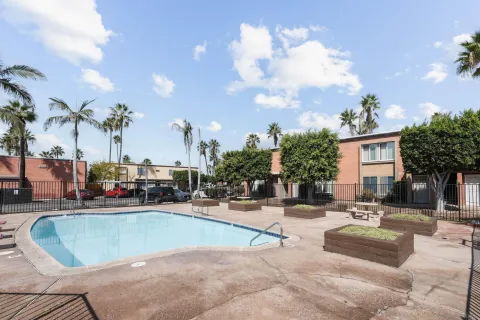a view of a swimming pool with outdoor seating