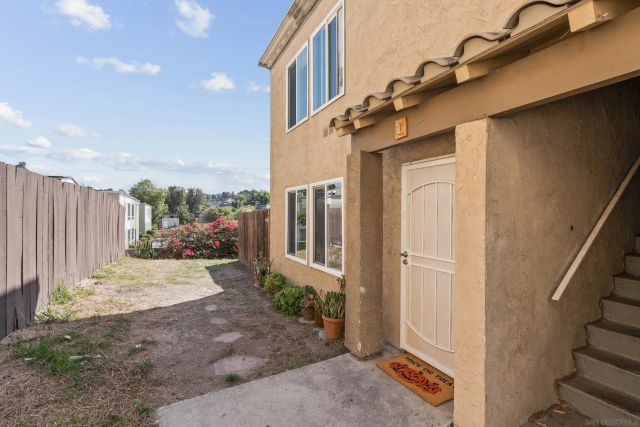 a view of a cars park in front of a building