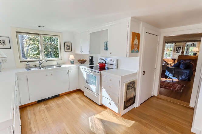 76 State Road Chilmark, MA 02535 - Photo 23 of 79 a kitchen with stainless steel appliances a white cabinets and a sink