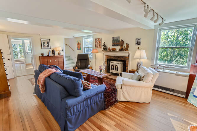 76 State Road Chilmark, MA 02535 - Photo 28 of 79 a living room with furniture a fireplace and a window