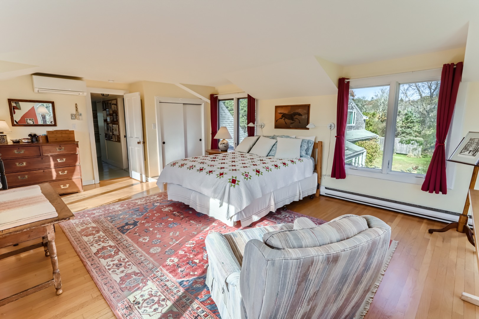 76 State Road Chilmark, MA 02535 - Photo 37 of 79 a bedroom with a bed and a dresser next to a window