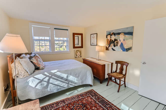 76 State Road Chilmark, MA 02535 - Photo 40 of 79 a bed room with a bed and a chair