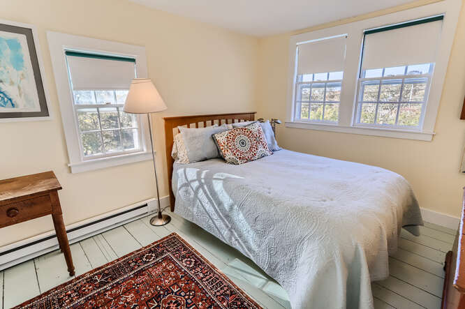 76 State Road Chilmark, MA 02535 - Photo 41 of 79 a bedroom with a large bed and a window